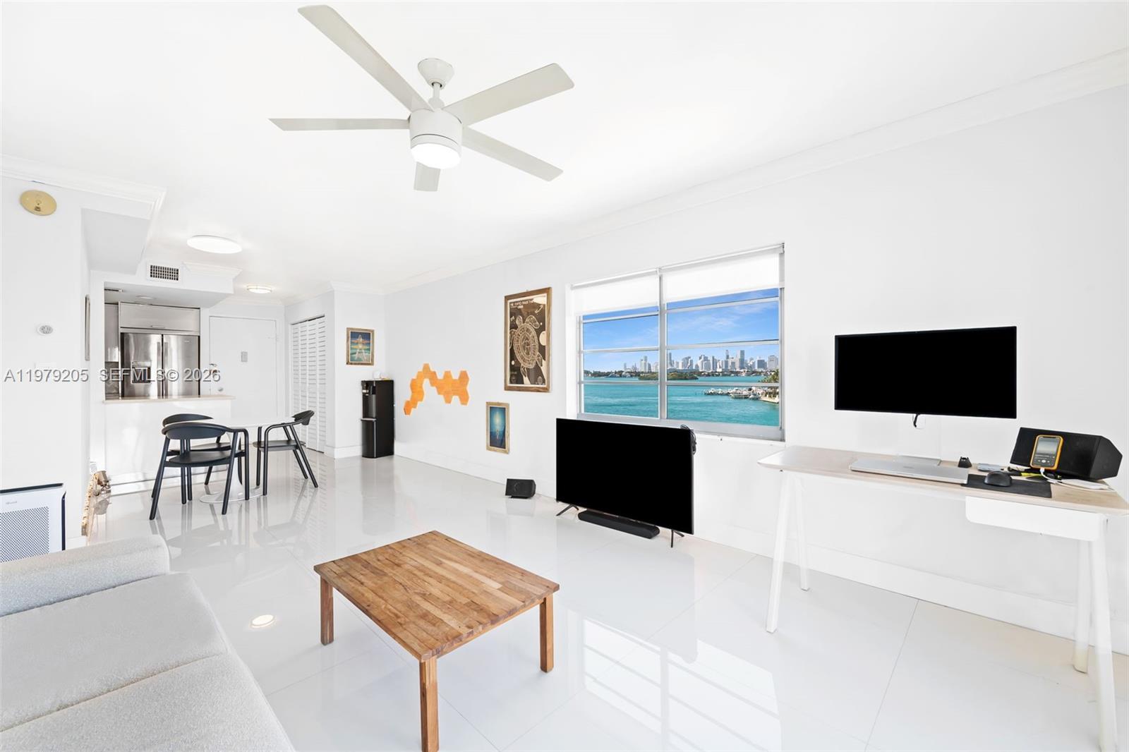 Image 3: Living area with bay & city skyline views