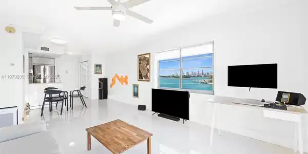 Image 3: Living area with bay & city skyline views