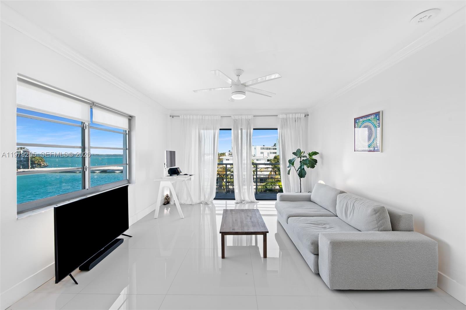Image 4: Living area with bay & city skyline views