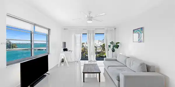 Image 4: Living area with bay & city skyline views
