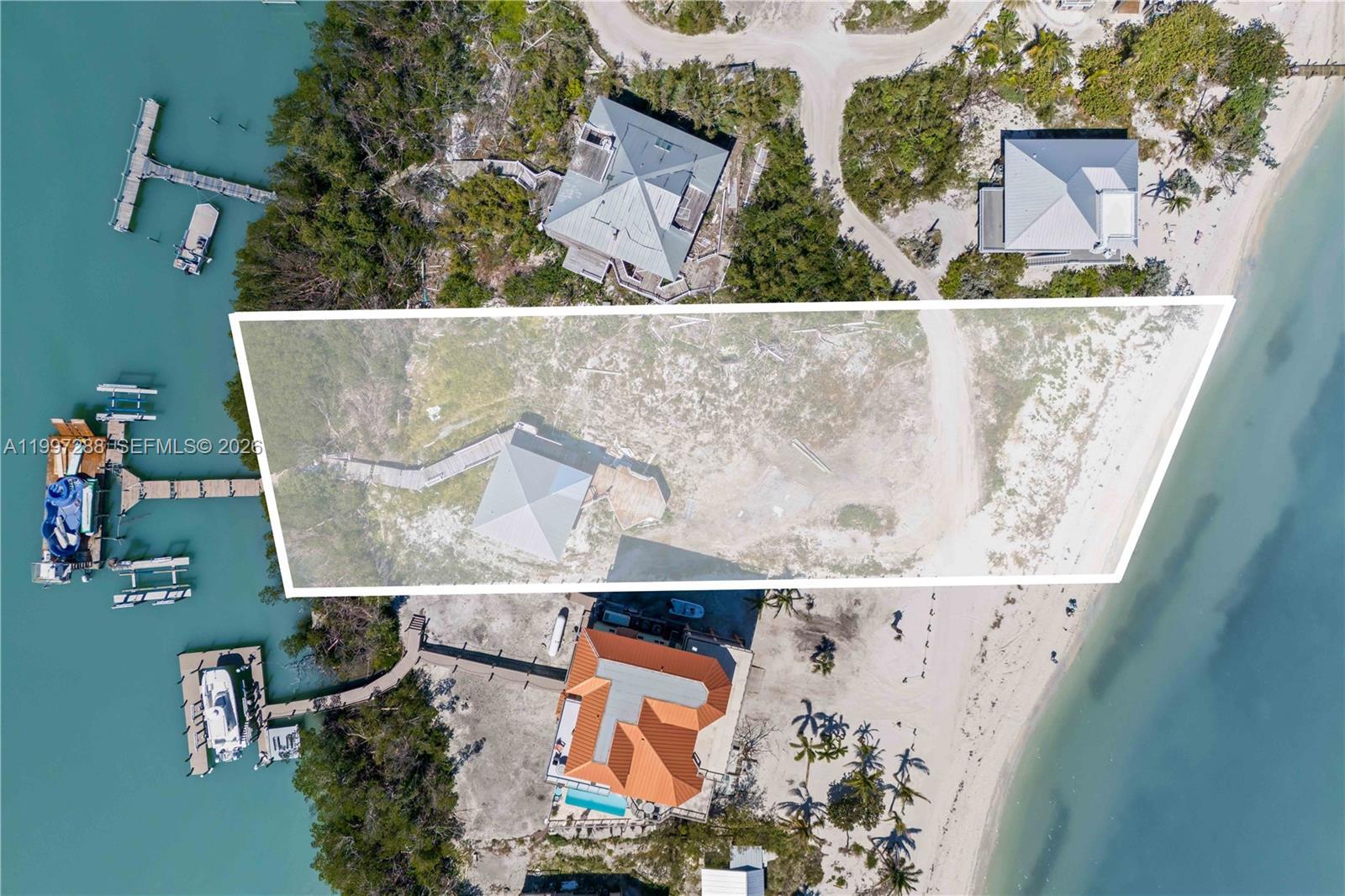 Image 3: Small guest home remains and is sold as-is. This is a rare property offering Bay to Gulf access with