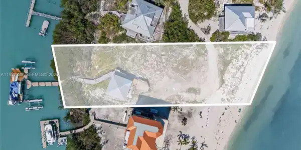 Image 3: Small guest home remains and is sold as-is. This is a rare property offering Bay to Gulf access with