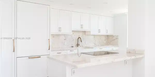 Image 3: Open concept kitchen with granite countertops