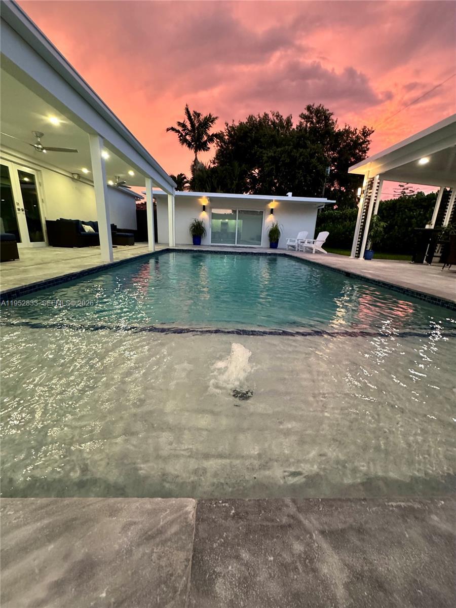 Image 1: Sun setting from the pool