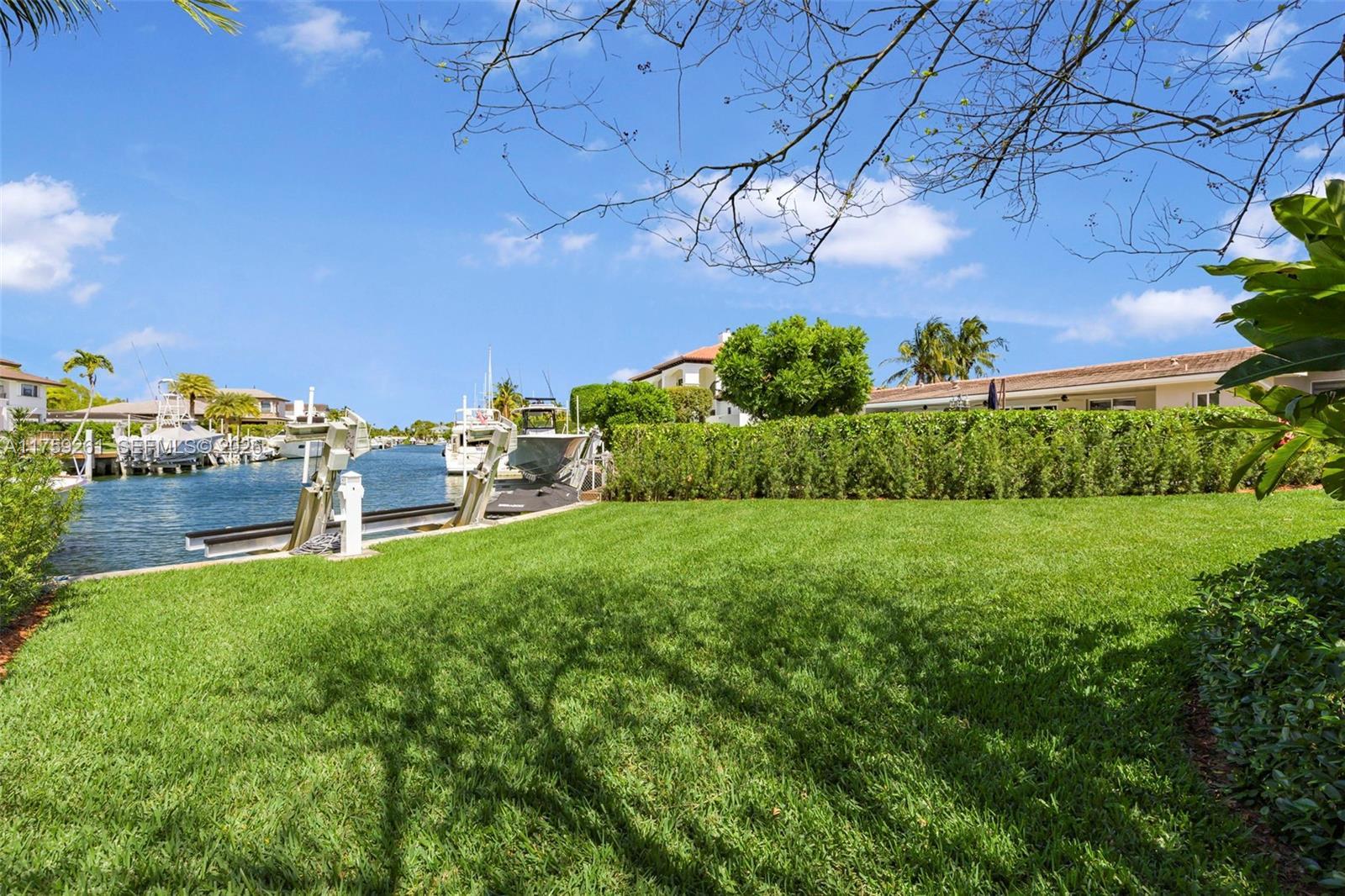 Image 3: Waterfront manicured back yard