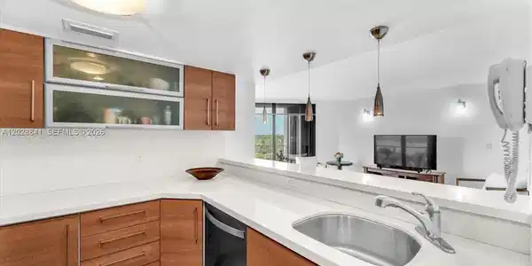 Image 2: Experience the charm of a beautifully renovated open kitchen, perfect for entertaining friends and w