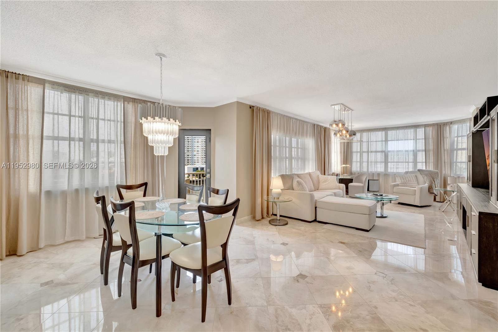 Image 2: Bright open dinning/living area