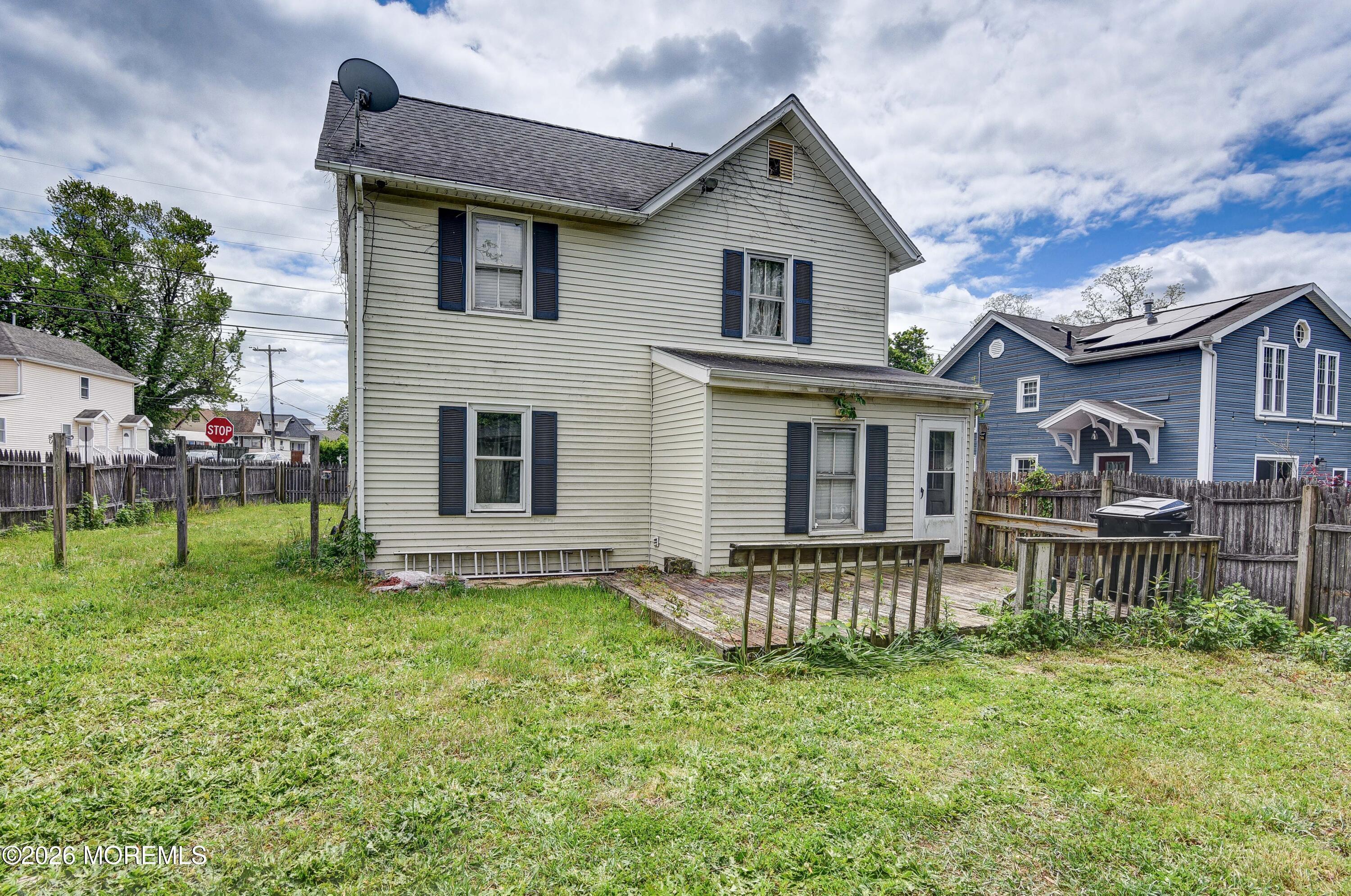 Image 2: Rear View of home and yard - View 3