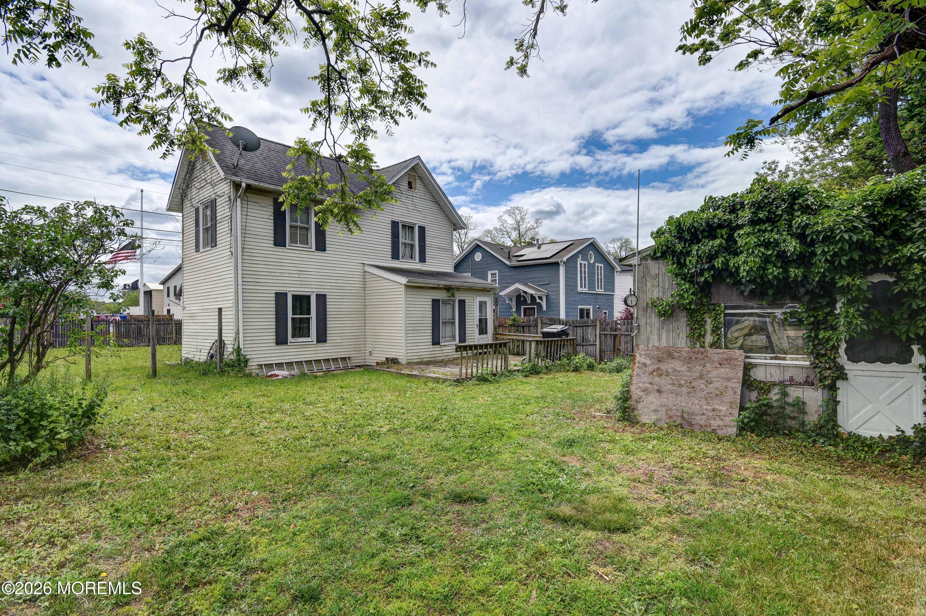 Image 3: Rear View of home and yard - View 2