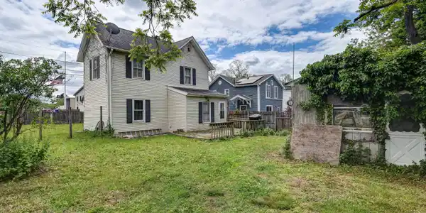 Image 3: Rear View of home and yard - View 2