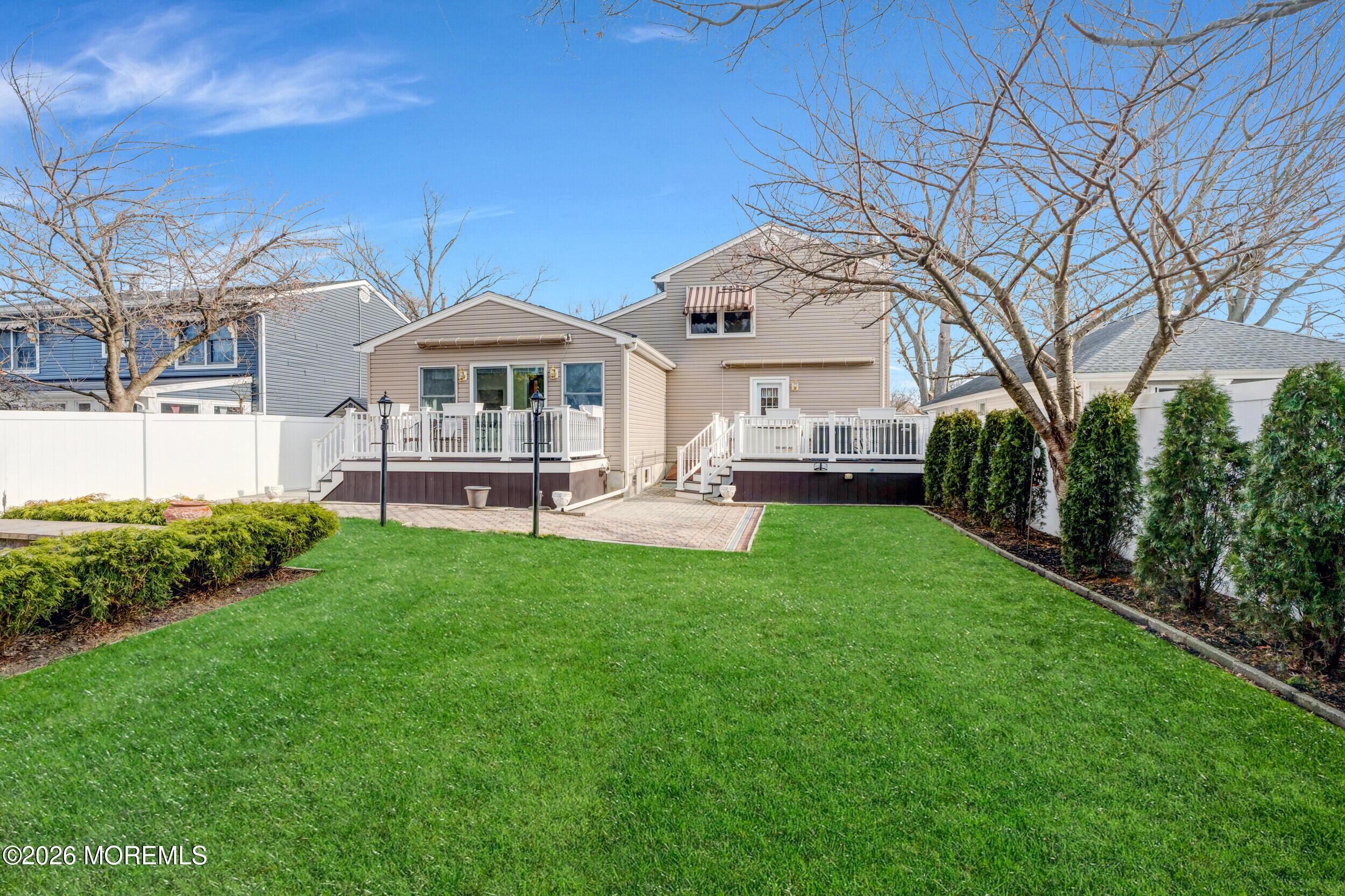 Image 3: Backyard Showcasing Both Units