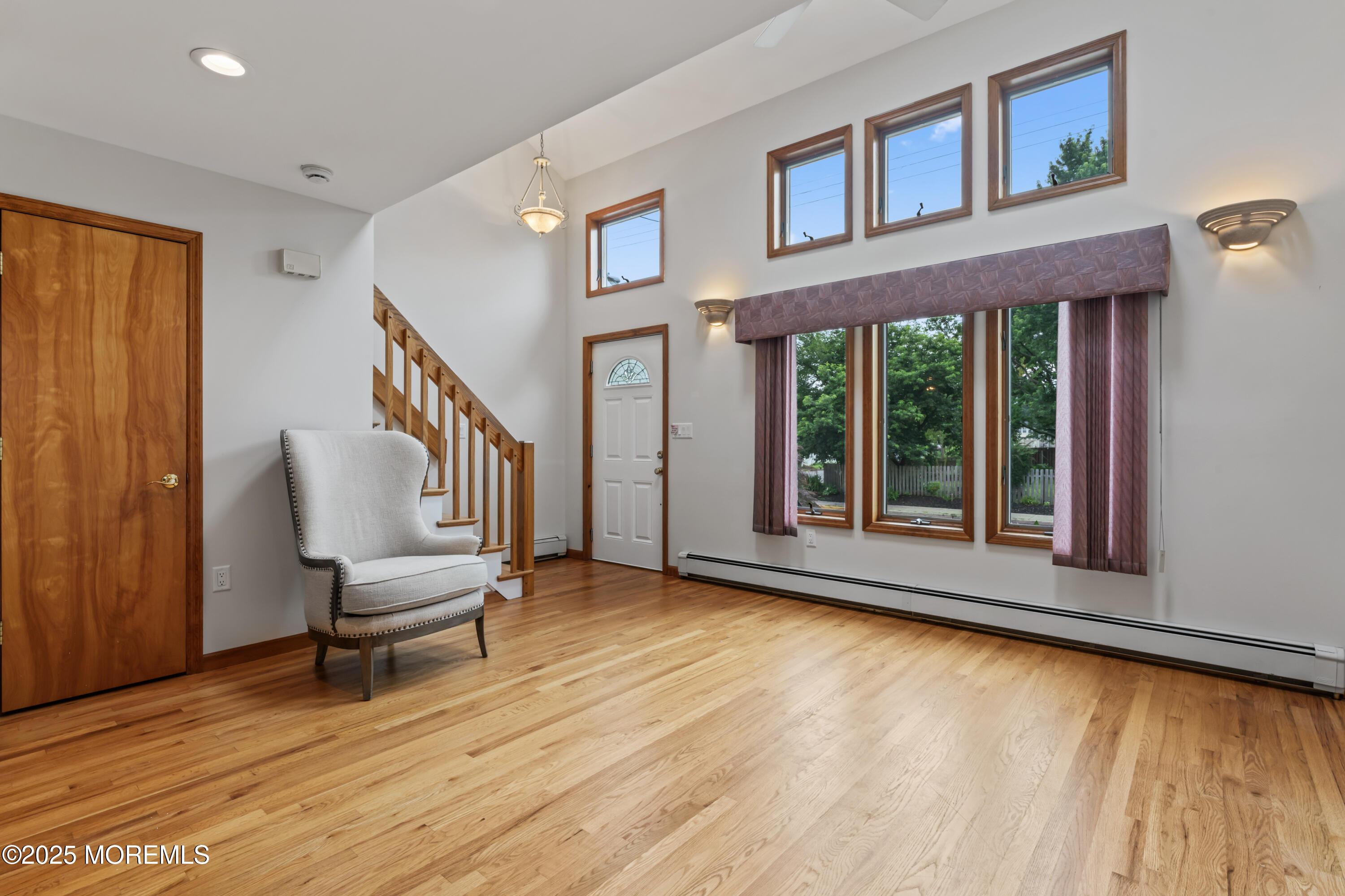 Image 3: 24 Bray Front Living room stairs