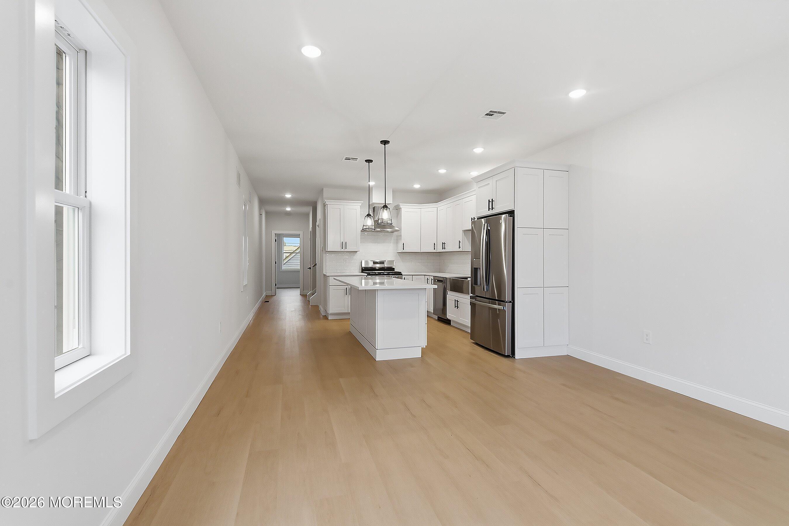 Image 2: Living Room to Kitchen