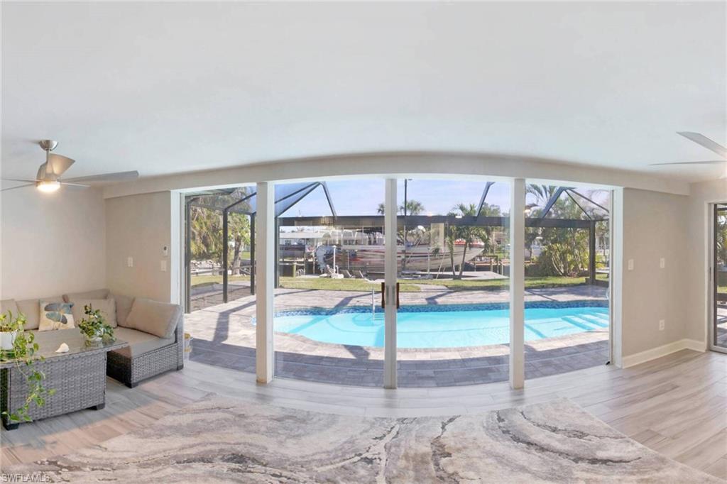 Image 4: Swimming pool featuring a patio area, outdoor lounge area, and a lanai