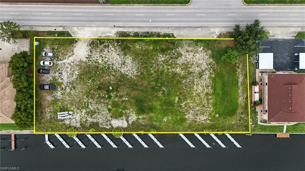 Image 1: Aerial view of property and surrounding area with property boundaries highlighted