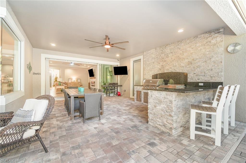 Image 2: Lanai with Outdoor Grilling Station & Plenty of Room for Entertaining