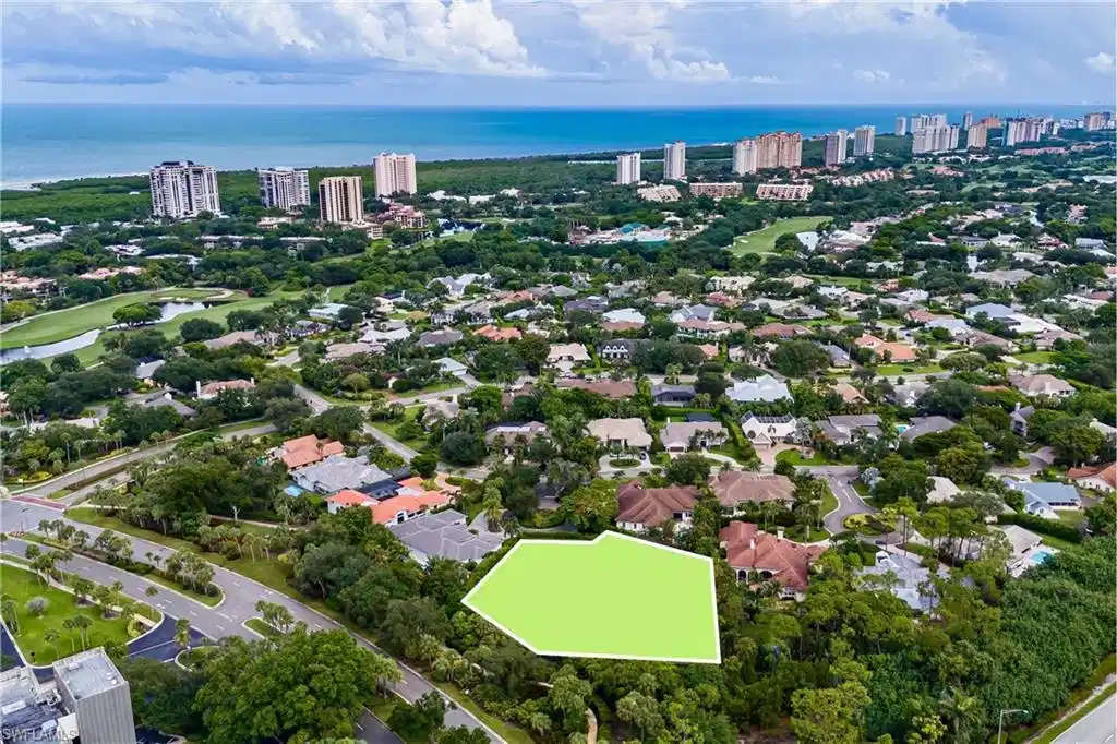 Image 1: Build your dream multi-generational compound on a private cul-de-sac lot offering an acre of exceptional privacy in coveted Pelican Bay in Naples