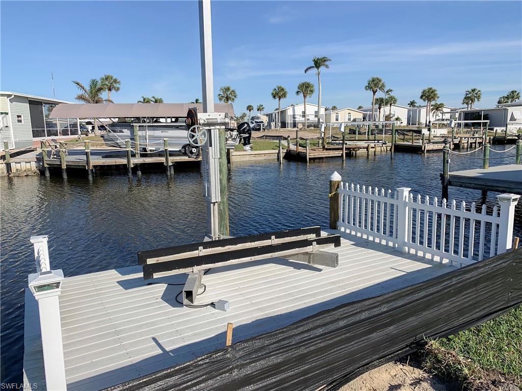 Image 1: Canal View from Dock with jet ski lift