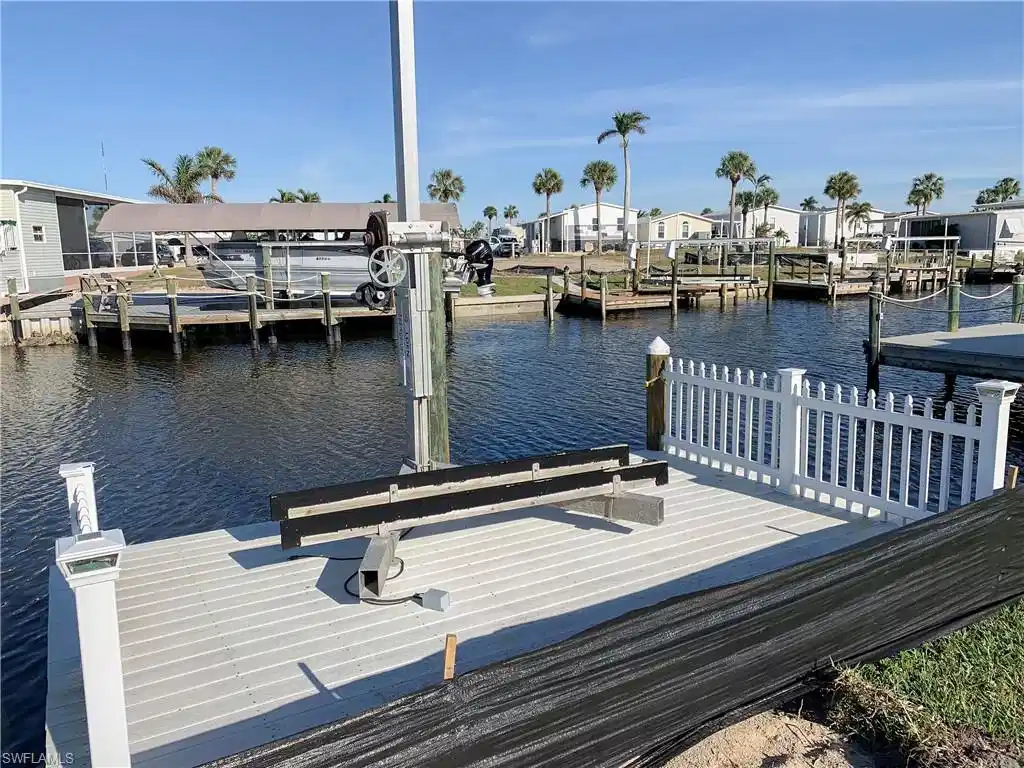 Image 1: Canal View from Dock with jet ski lift
