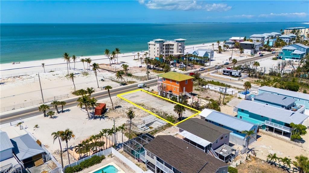 Image 1: Bird's eye view with a beach view and a water view - VIRTUALLY EDITED EXTERIOR IMAGE
