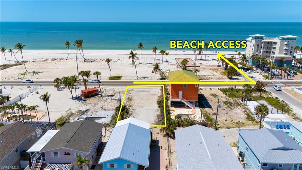 Image 2: View of property location featuring property boundaries highlighted and unending shoreline- Virtually Enhanced