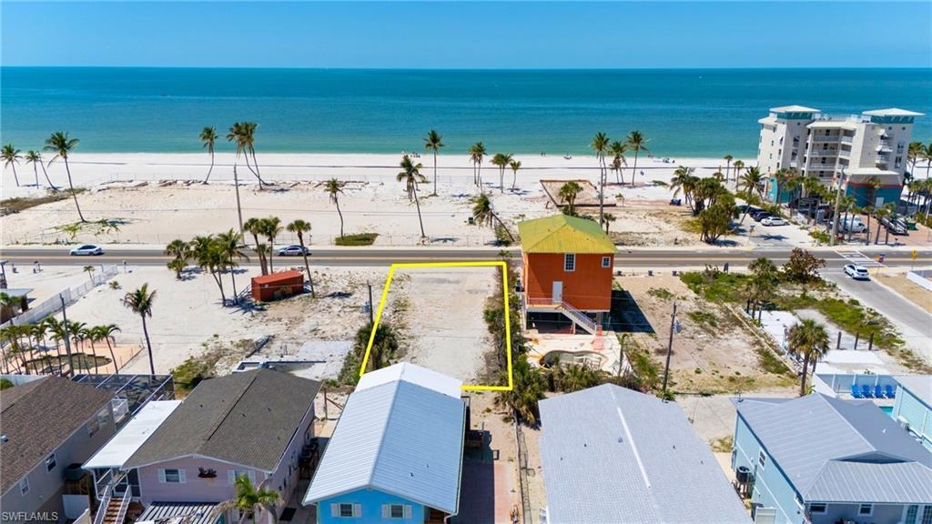 Image 4: Aerial view featuring a water view and a view of the beach- VIRTUALLY EDITED EXTERIOR IMAGE