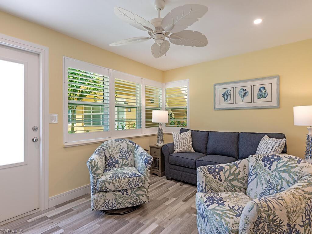 Image 1: This bright and open living room welcomes you home with open arms!