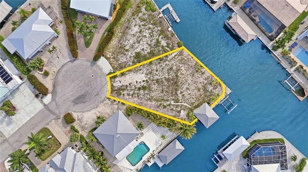 Image 3: Vacant land parcel featuring waterfront access and a cul-de-sac location - Virtually Edited Image
