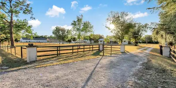 Image 3: Gated entrance to property with keypad.