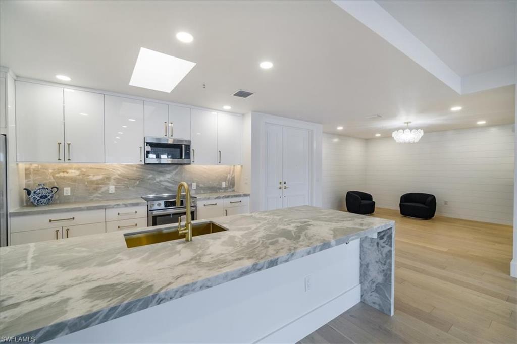 Image 1: remodeled white kitchen
