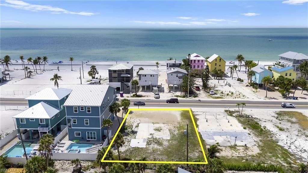 Image 2: Sunsets Galore Birds eye view of property with a water view and a residential view  - Virtually Edited Image