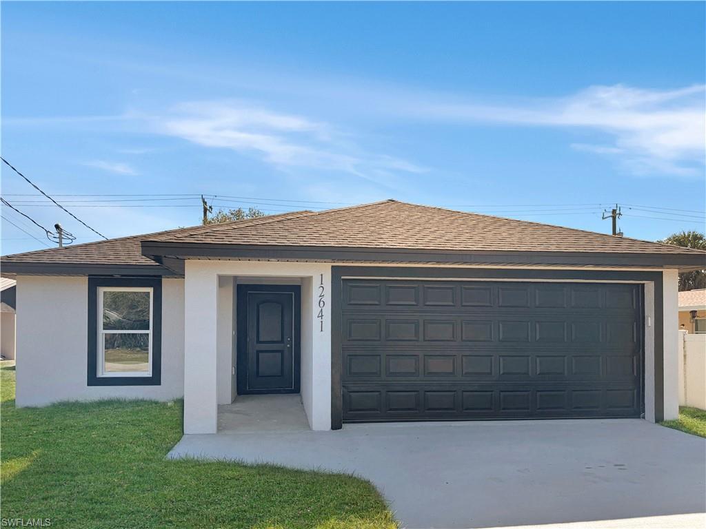 Image 1: Ranch-style house featuring stucco siding, a shingled roof, and a front lawn