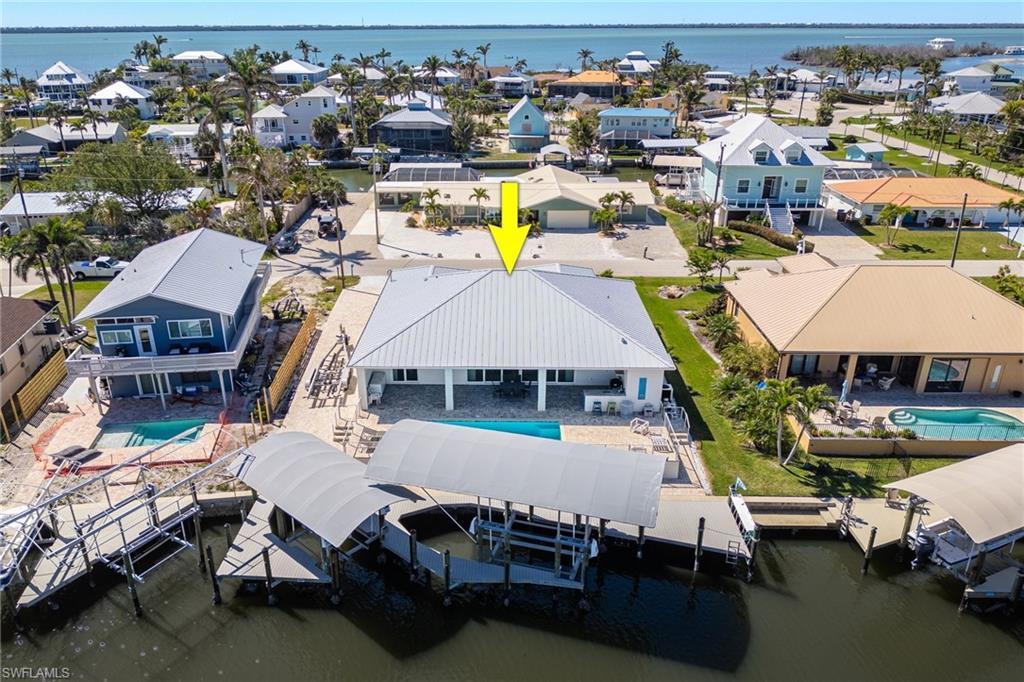 Image 1: Aerial view featuring a residential view and a water view