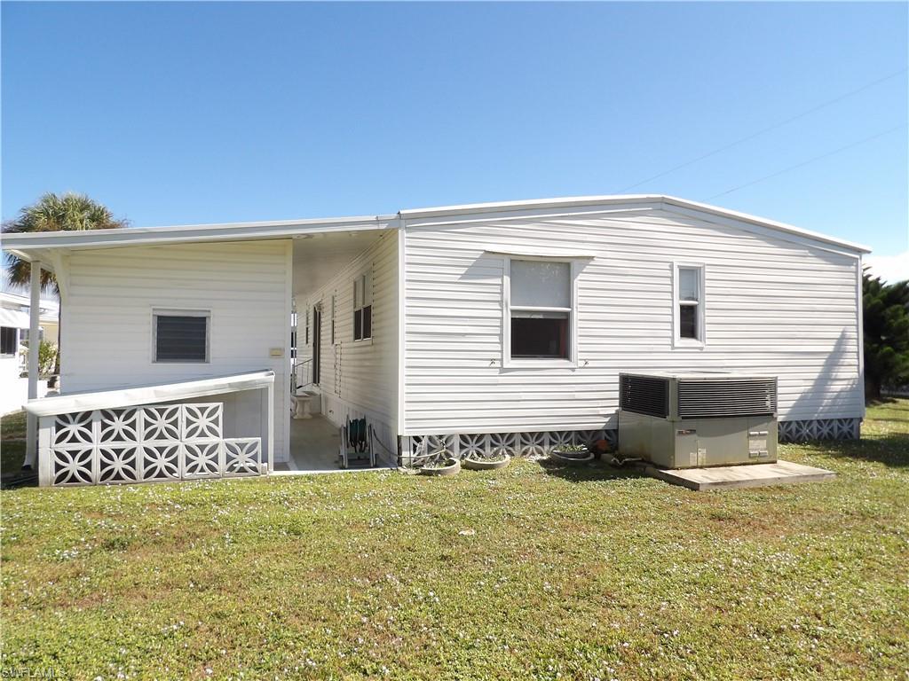 Image 3: Rear view of property featuring a yard