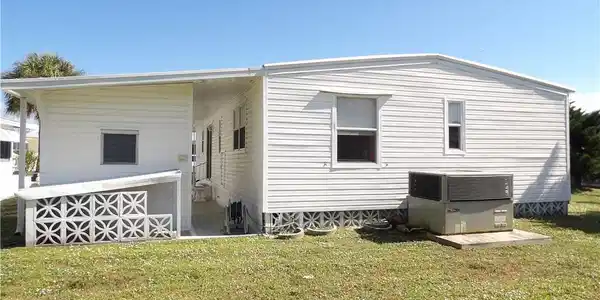 Image 3: Rear view of property featuring a yard