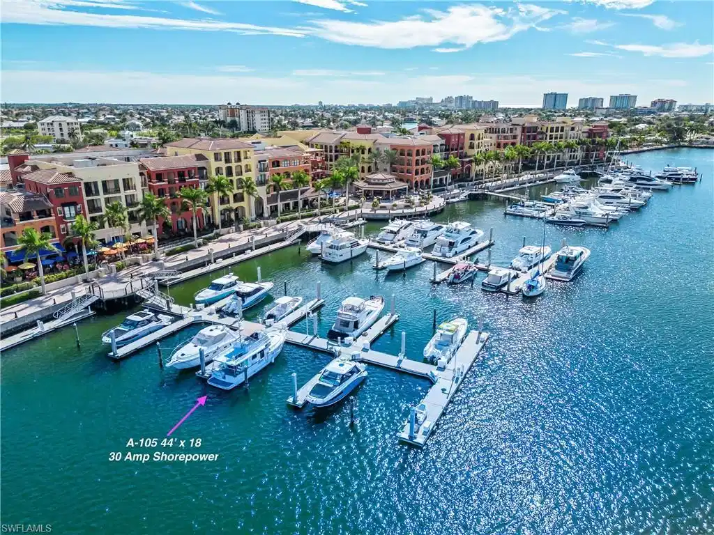 Image 1: View of urban area with a large body of water and numerous boat docks
