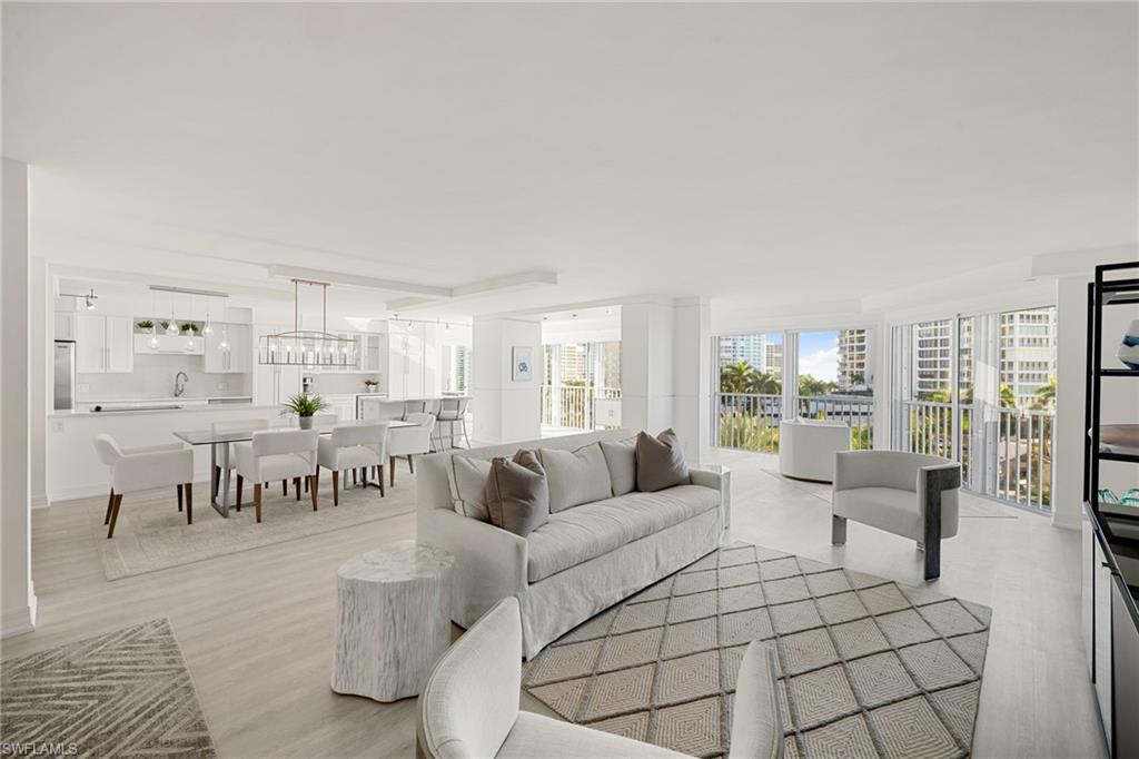 Image 1: Living room with light wood finished floors