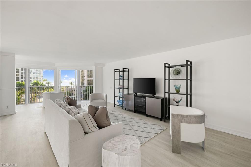 Image 2: Living room featuring wood finished floors