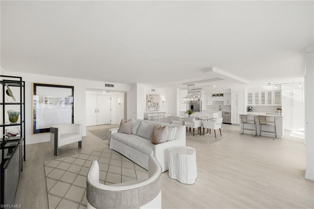 Image 3: Living room with light wood-style flooring
