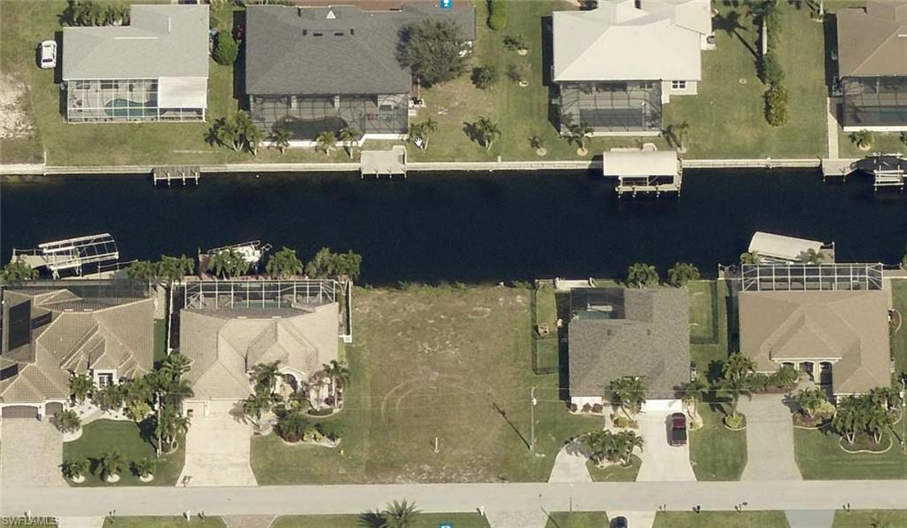 Image 3: View of property location with nearby suburban area and a nearby body of water