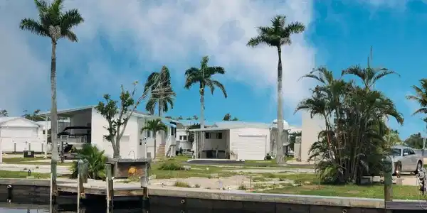 Image 2: Back of house featuring a water view