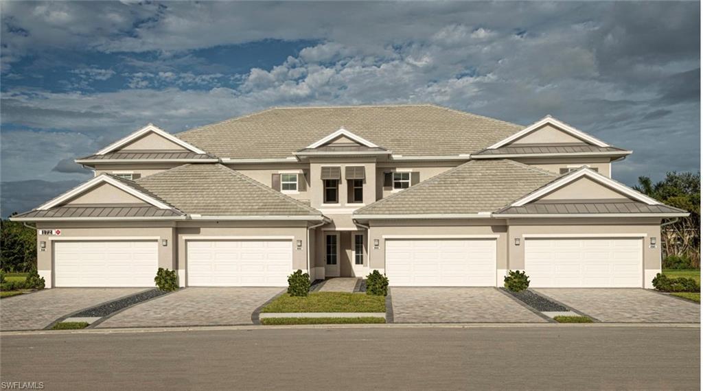 Image 1: View of front of house featuring a garage