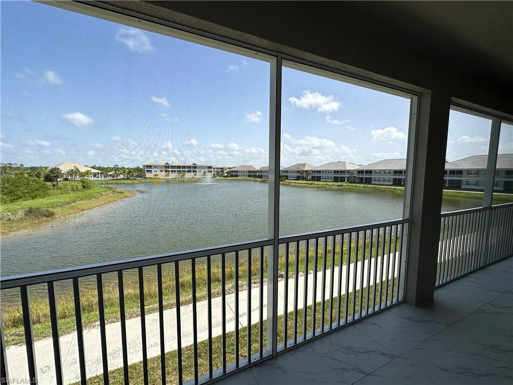 Image 2: Unfurnished sunroom featuring a water view