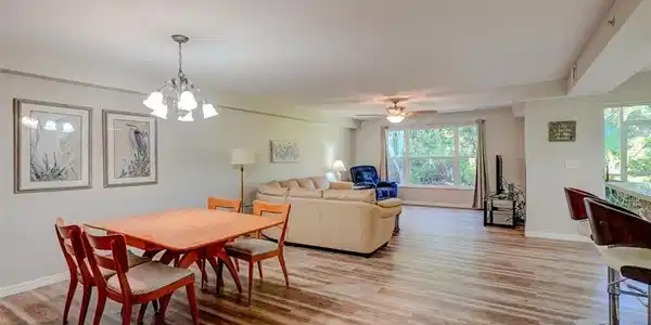 Image 3: Dining space with light wood-type flooring, a chandelier, and a ceiling fan
