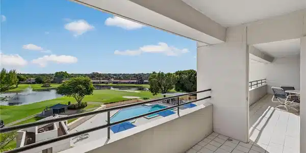 Image 3: View from balcony of Pool, Golf Course, Lake and Sunrises