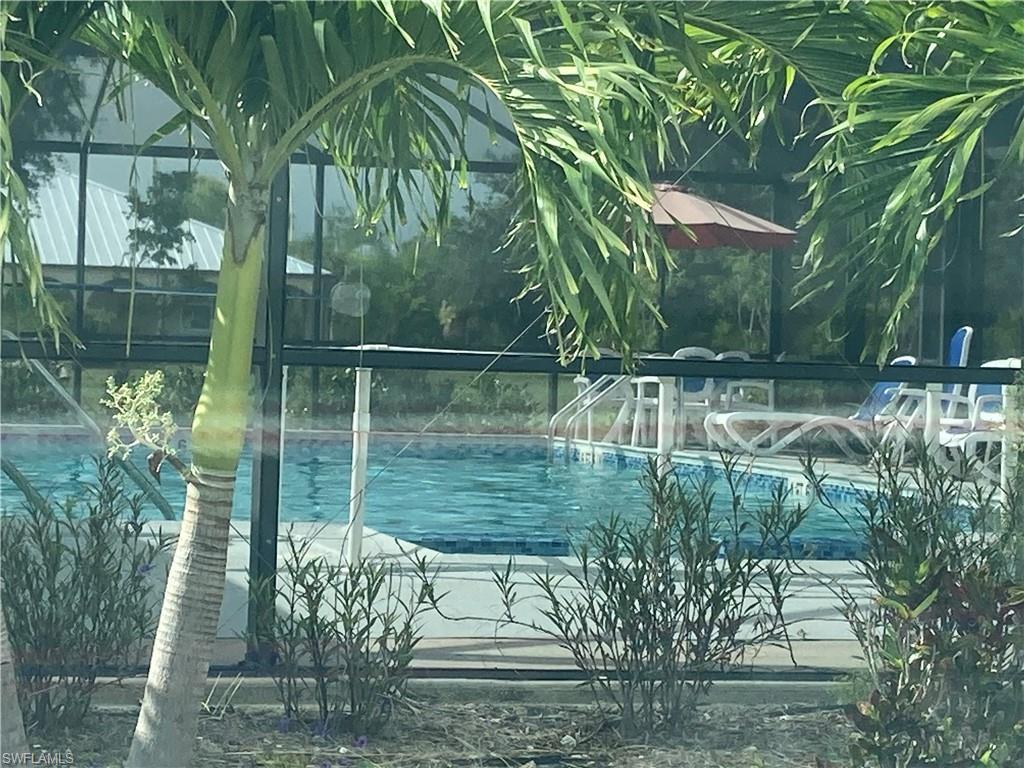 Image 4: Community pool with a lanai