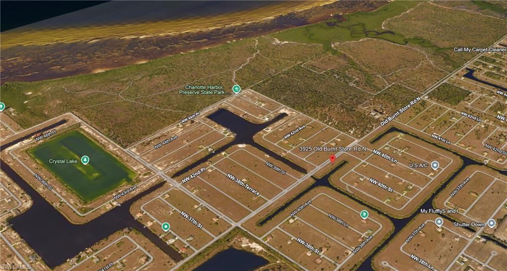 Image 2: Aerial perspective of suburban area featuring a large body of water