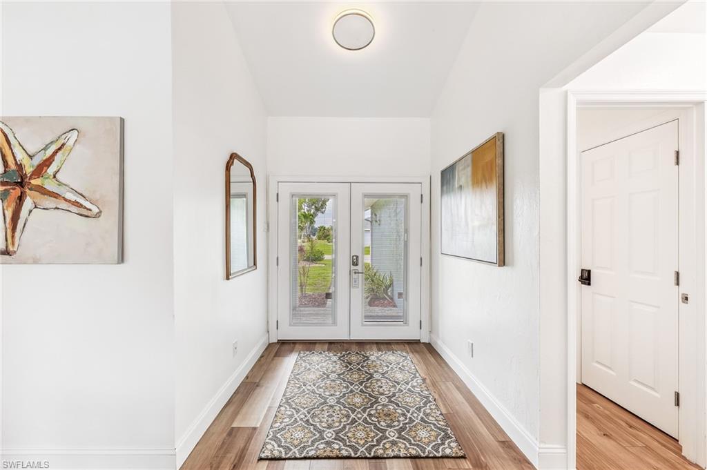 Image 4: Entryway featuring light wood-style flooring and french doors