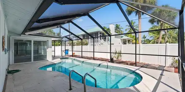 Image 4: Inviting pool with screen enclosure