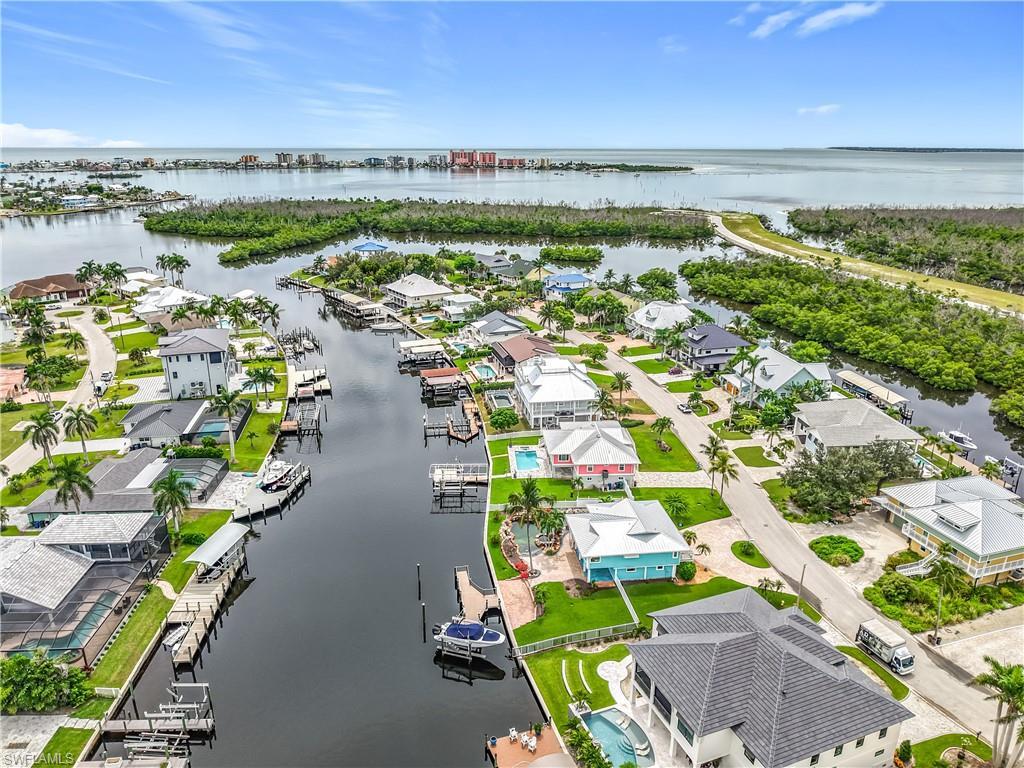 Image 3: Aerial view of home, canal and short distance and sailboat access to Gulf .